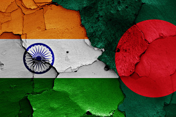 flags of India and Bangladesh painted on cracked wall
