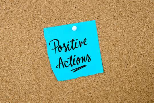 Positive Actions Written On Blue Paper Note