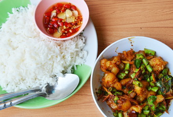 spicy stir fried pork tendon with herb and plain rice