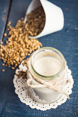 Fototapeta na wymiar vegan fresh milk from hemp seeds in a glass jar, clean eating
