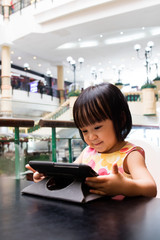 Asian Little Chinese Girl Looking at Digital Tablet