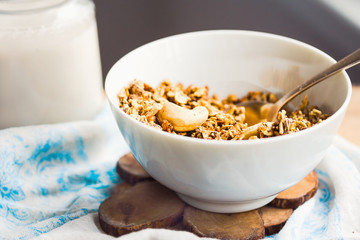 granola with cashews and banana with vegan milk, breakfast