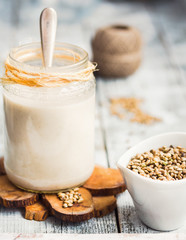 homemade vegan milk from hemp seeds in a glass jar
