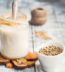 homemade vegan milk from hemp seeds in a glass jar