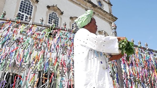 Brazilian man wearing traditional clothes at Bonfim Church in Salvador, Bahia, Brazil