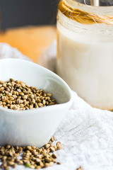 homemade vegan milk from hemp seeds in a glass jar