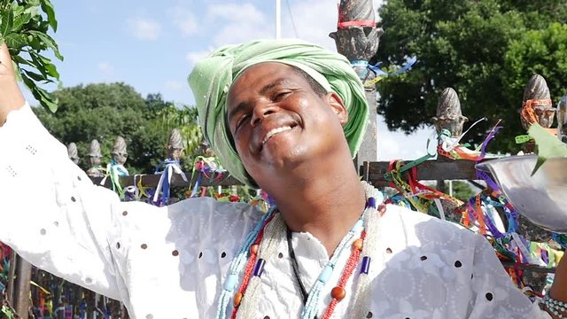 Brazilian man wearing traditional clothes at Bonfim Church in Salvador, Bahia, Brazil