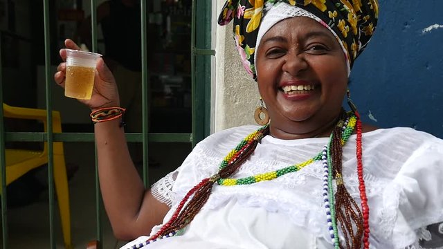 Brazilian woman - Baiana drinking beer in Pelourinho, Salvador, Bahia