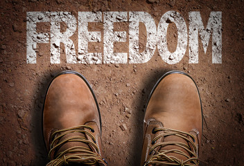 Top View of Boot on the trail with the text: Freedom