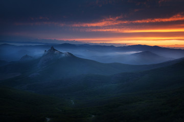 Sunset over the mountains with clouds