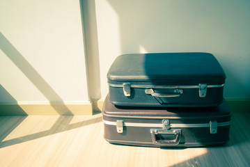 Old suitcases. Brown and black retro suitcase. Vintage baggage.