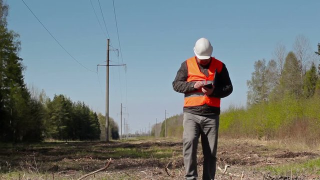Electrician inspect the high-voltage power lines technical condition