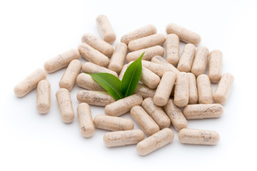 Ginkgo biloba capsule on the white background.