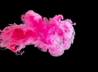 The clouds of paint in the dark water