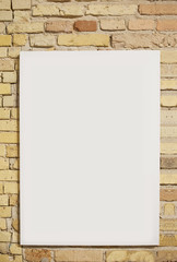 brick wall and white sheet with space for text