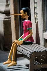 Pinocchio puppet made from wood - obrazy, fototapety, plakaty