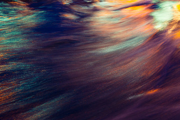 City lights reflection. Colorful glare on the water