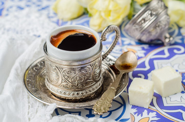 turkish coffee cup  with locum on ornament background. selective focus