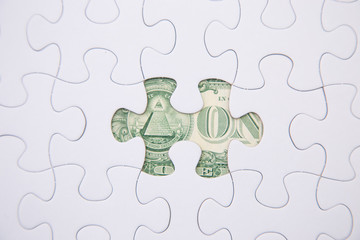puzzle and dollar