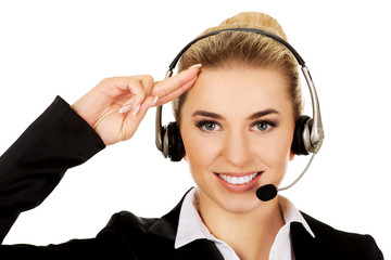 Salute young businesswoman in headphones