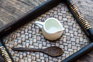 top view photography of mini jar of syrup and wooden spoon all t