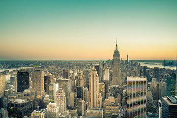 Fototapeta na wymiar Midtown Manhattan view across skyscrapers in New York City with vintage filter effect