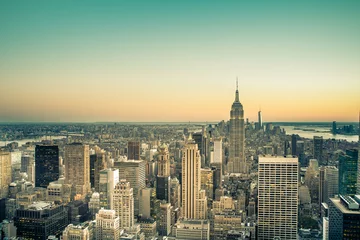 Fotobehang Midtown Manhattan view across skyscrapers in New York City with vintage filter effect © littleny