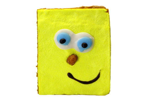 Brownie Cake With Human Smiling Yellow Face Isolated On White