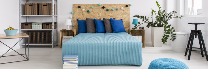 Double bed in trendy bedroom