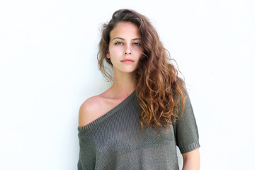 Attractive confident woman standing against white background