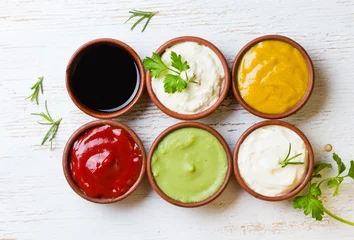 Rolgordijnen Sauces ketchup, mustar, mayonnaise, wasabi, soy sauce in clay bowls © lblinova