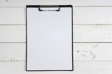 Business blank, notepad,  coffee cup and pen at office desk table top view. Corporate stationery branding mock-up