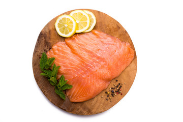 Salmon fillet on wooden board