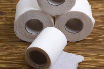 Toilet paper on wooden board