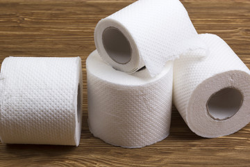 Toilet paper on wooden board