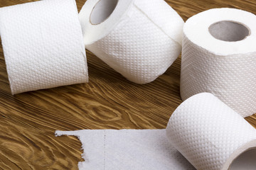 Toilet paper on wooden board