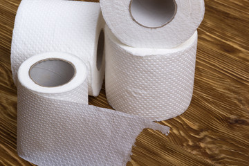 Toilet paper on wooden board