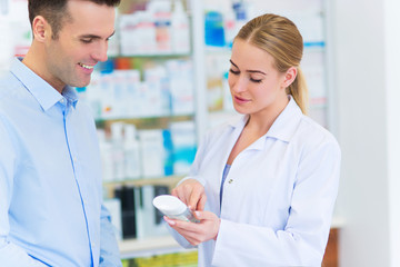 Pharmacist and client at pharmacy
