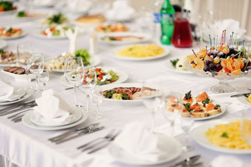 Served table in restaurant with dishes and glasses