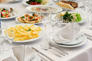 Served table in restaurant with dishes and glasses