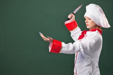 Composite image of pretty chef slicing with knife
