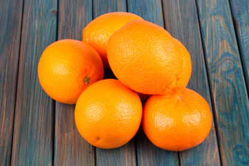 oranges on a blue wooden table