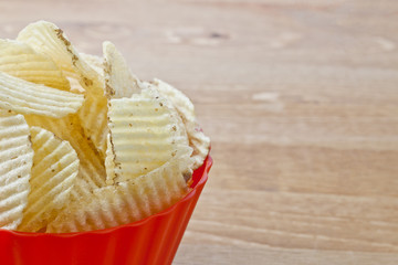 cropped bowl of salted chips