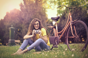 Girl taking pictures in the park