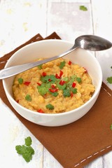 Pease pudding with coriander and chilli in the bowl