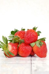 Strawberries on the wooden background