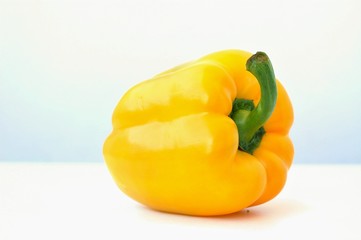 Yellow pepper on the white background