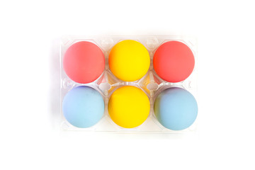 Top view of colorful eggs in plastic box