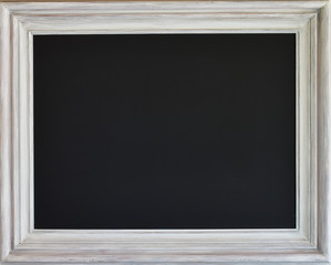 Chalk board with white rustic wooden frame.
Copy space.