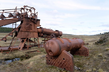 Abandoned gold mine at lake Lago Blanco. English mechanical dredge was engaged in gold mining from...